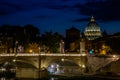 The bridge over the Tiber River and the Vatican dome at sunset in the evening in a summer day in Rome, Italy Royalty Free Stock Photo