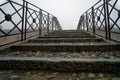 Bridge over the water canal in the autumn, haze weather, foggy morning in the national park