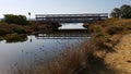 Bridge over water. Porto Pino pond, Sardinia Italy Royalty Free Stock Photo