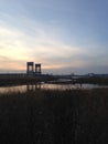 Bridge over Wetlands and Hackensack River during Sunset in Jersey City, NJ. Royalty Free Stock Photo