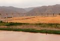 Bridge over Yellow river Huang He in Tengger desert, Shapotou, China Royalty Free Stock Photo