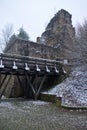 Bridge and part of Falkenstein castle ruins on winter day Royalty Free Stock Photo