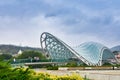 Bridge of Peace - a bow-shaped pedestrian bridge of steel and glass construction illuminated with numerous LEDs over the Kura Royalty Free Stock Photo