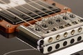 Bridge and pickup of an electric guitar Royalty Free Stock Photo