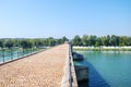 The bridge Pont Saint-BÃÂ©nÃÂ©zet at Avignon on the river Rhone with tourists standing in the distance