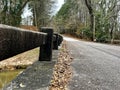 Bridge rail view an old gravel country road Royalty Free Stock Photo