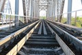 Bridge on the railroad tracks and industrial gray stone