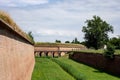 The bridge, red bricks wall and a ditch outside the former Terezin concentration camp, Czech Republic