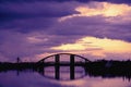 Bridge reflection in water surface of river Dnieper duaring sunset time. Royalty Free Stock Photo