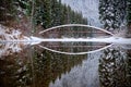 Bridge and reflection. Winter forest and lake. Lightning lake. Manning Park. Hope. British Columbia. Canada. Royalty Free Stock Photo