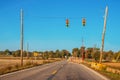 Bridge repair with one lane open and temporary traffic lights in rural Indiana on a late autumn morning with crane and other