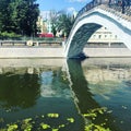 Bridge on the river in the city and reflection in the water