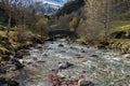 Bridge on river in Gavarnie circus France autumn