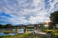 Bridge River Kwai with sky and sun in Kanchanaburi, Thailand Royalty Free Stock Photo