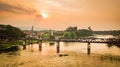 The Bridge on the River Kwai and sunset in Kanchanaburi,Thailand. Royalty Free Stock Photo