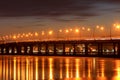 Bridge on the river, the lights reflected on the ice of a frozen river in the evening, Dnieper city.