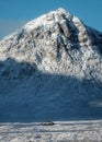 The bridge and road leading across the Scottish Highlands of Glen Coe with the snow mountain in the background Royalty Free Stock Photo