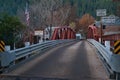 Bridge with road signs and the US flag in a small town of Downieville in CA, USA Royalty Free Stock Photo