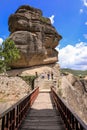 Bridge, rock and tourists at the Monastery of Varlaam of the Meteora Eastern Orthodox monasteries complex in Kalabaka Royalty Free Stock Photo