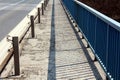 Bridge sidewalk with guardrail and fence Royalty Free Stock Photo