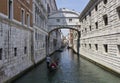 The Bridge of Sighs and a gondolier navigating.