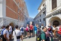 Bridge of Sighs people and tour tourists passing and shooting photos in Venice, Italy