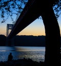Bridge silhouette over looking the River Royalty Free Stock Photo