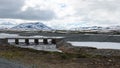 Bridge and snow capped mountains on Stekenjokk plateau in Sweden Royalty Free Stock Photo