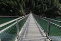 The bridge spanning over the clear and emerald water