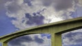 A bridge stretching across a dramatic sky Royalty Free Stock Photo