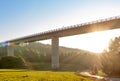 Bridge structure from underneath with background forest