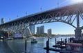 Bridge to greenville and water bus passing under the bridge Nature Canada Vancouver Pacific Ocean Pier and pillars on Royalty Free Stock Photo