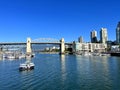 Bridge to greenville and water bus passing under the bridge Nature Canada Vancouver Pacific Ocean Pier and pillars on Royalty Free Stock Photo