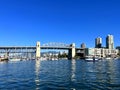 Bridge to greenville and water bus passing under the bridge Nature Canada Vancouver Pacific Ocean Pier and pillars on Royalty Free Stock Photo