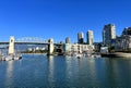 Bridge to greenville and water bus passing under the bridge Nature Canada Vancouver Pacific Ocean Pier and pillars on Royalty Free Stock Photo