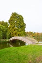 Bridge to an island in the Youth Park and an autumn landscape in the background Royalty Free Stock Photo
