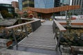 Modern foot bridge to North Kumutoto Pavilion with strips on folded plates on coastal decked square in Wellington CBD, New Zealand Royalty Free Stock Photo