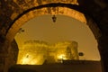 Bridge and towers of Kalemegdan fortress covered with fog at night, Belgrade Royalty Free Stock Photo