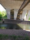 Bridge underside with dirty water Royalty Free Stock Photo