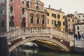 Venice bridge glowing reflection