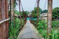 The bridge between the villages is worn, rusty and rotten. just waiting for the time to collapse Royalty Free Stock Photo