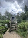 A bridge walkway crossing a quiet river