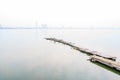 Bridge in west lake in fog, Hanoi, Vietnam Royalty Free Stock Photo