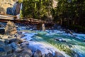 Bridge by Yosemite Lower Falls crossing over dangerous frosty and slushy cold river during early spring Royalty Free Stock Photo