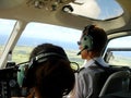 Helicopter pilot flying tourist around the island of Bridgetown, Barbados