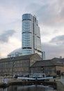 bridgewater place over the canal dock at granary wharf with converted office buildings and lock gates in leeds england