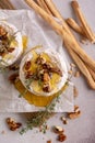 Brie or camembert cheese with thyme, nuts, honey and grissini breadstick Royalty Free Stock Photo