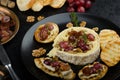 Brie cheese baked with nuts and grapes Royalty Free Stock Photo