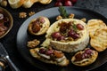 Brie cheese baked with nuts and grapes Royalty Free Stock Photo