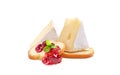 Brie cheese. Camembert cheese. Fresh cheese with cranberry jam on a piece of bread. Baguette crackers.